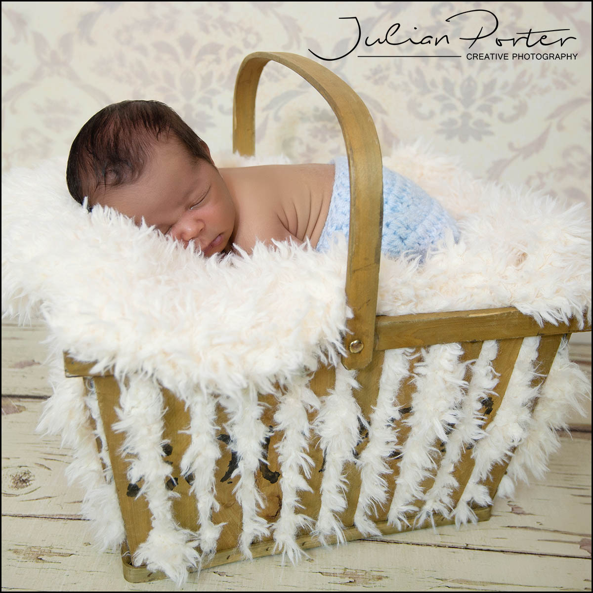 newborn with basket