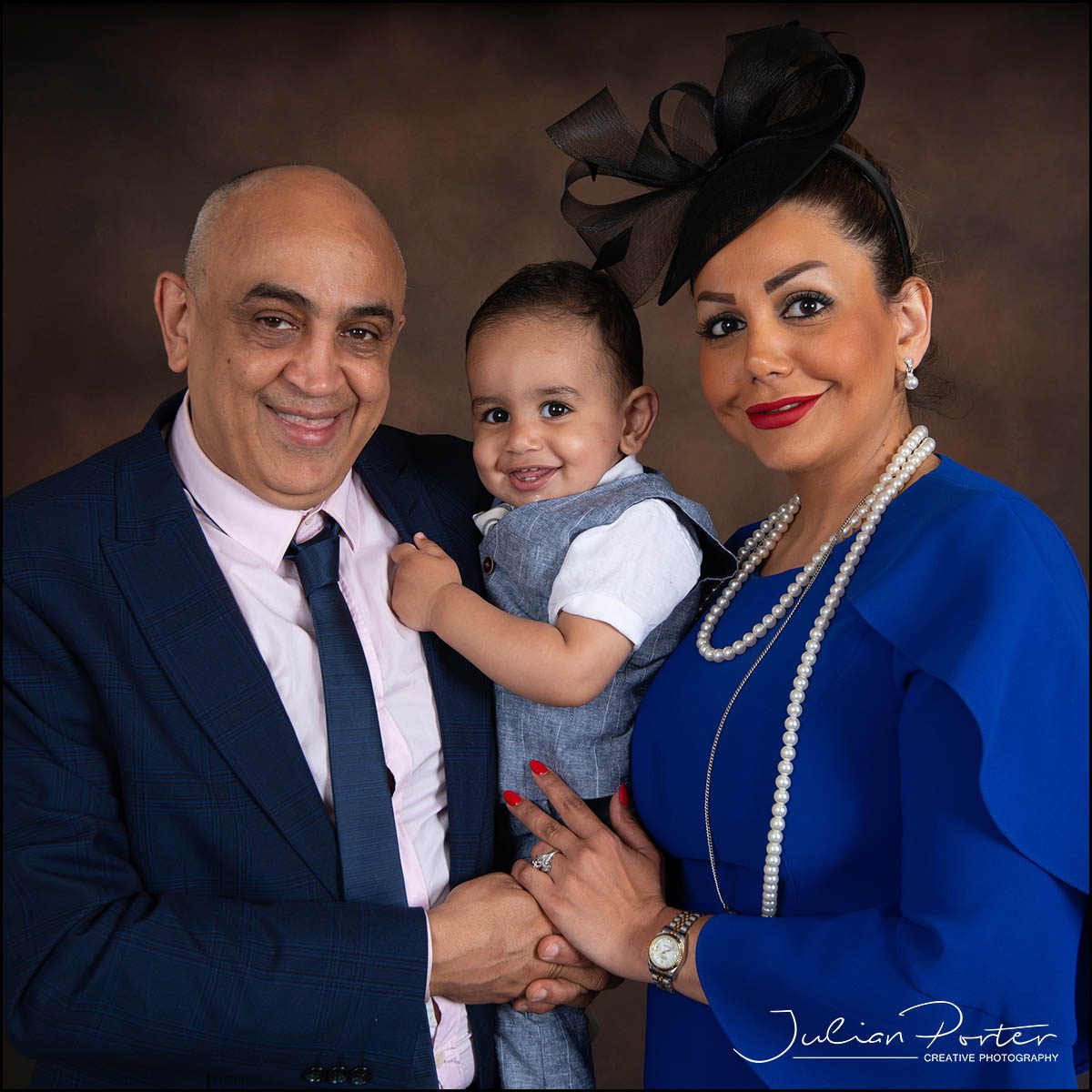 formal family portrait mum, dad and boy
