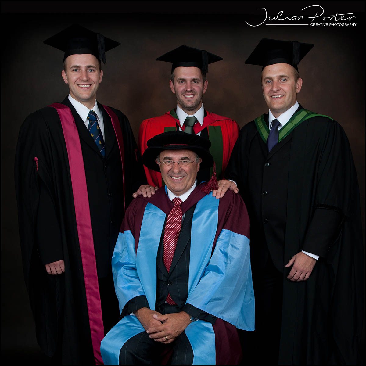 3 sons and dad graduation photo