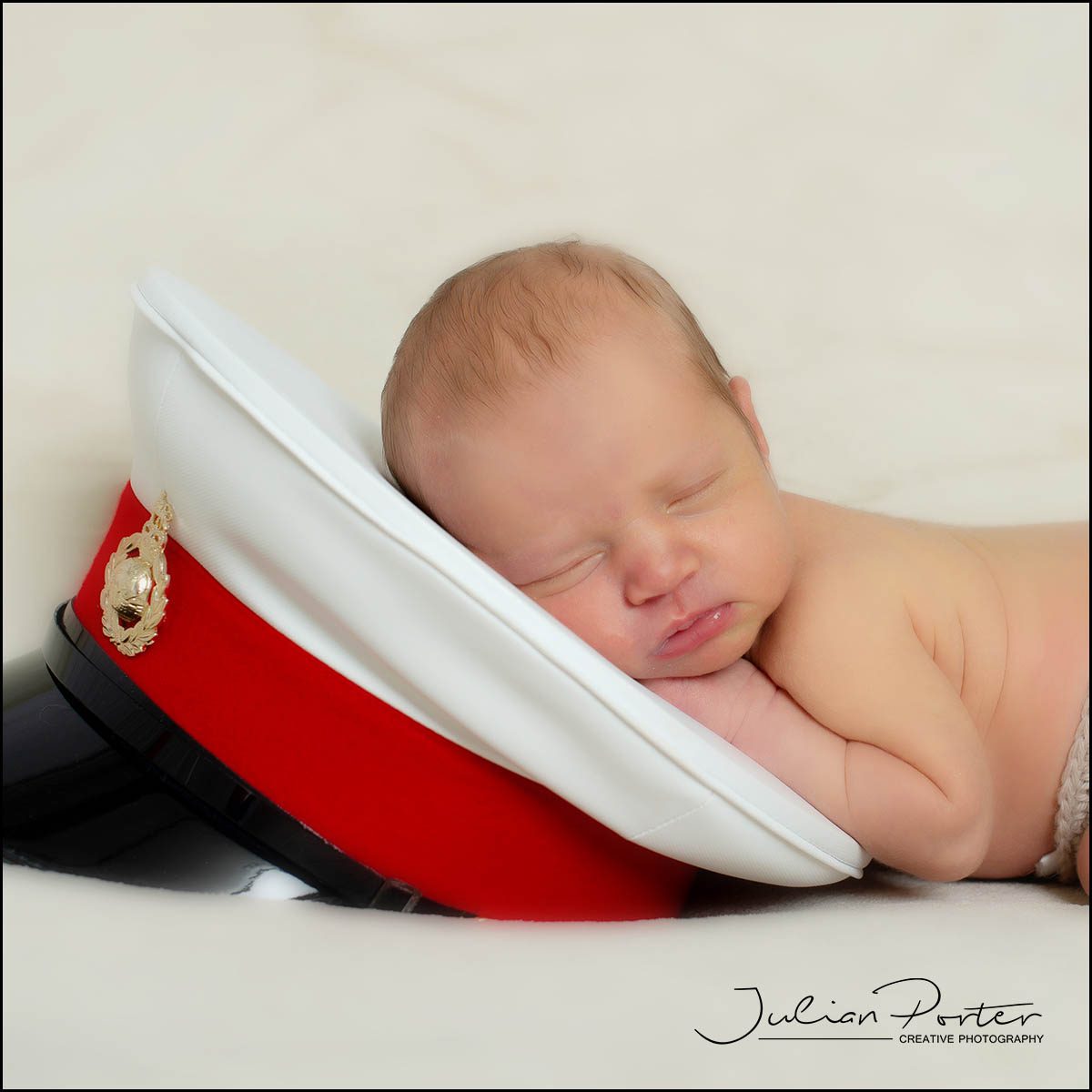 newborn baby on marine hat